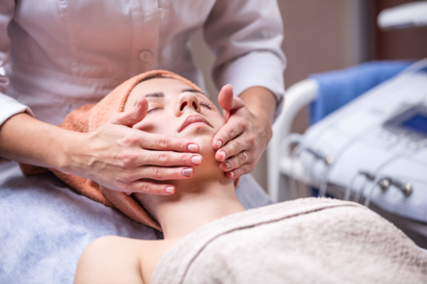 young-woman-in-spa-salon-beautician-performing-PNYJVZG